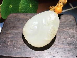 帮忙看和田玉籽料真假怎么看,和田玉籽料真假辨识技巧揭秘
